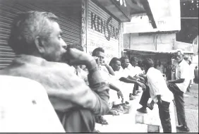 Unemployed mill workers waiting for casual jobs